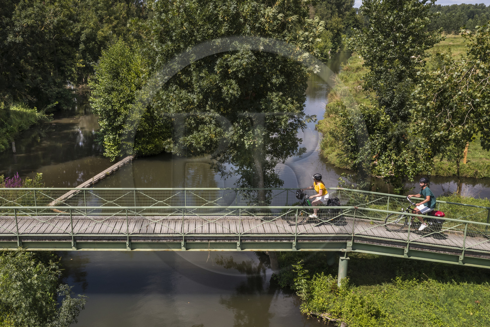 France, Deux-Sèvres, le Marais Poitevin, Green Venice, Sansais, bicycle journey along the Sevre Niortaise River banks on the Vélo Francette cycle path, passage of a footbridge (aerial view)