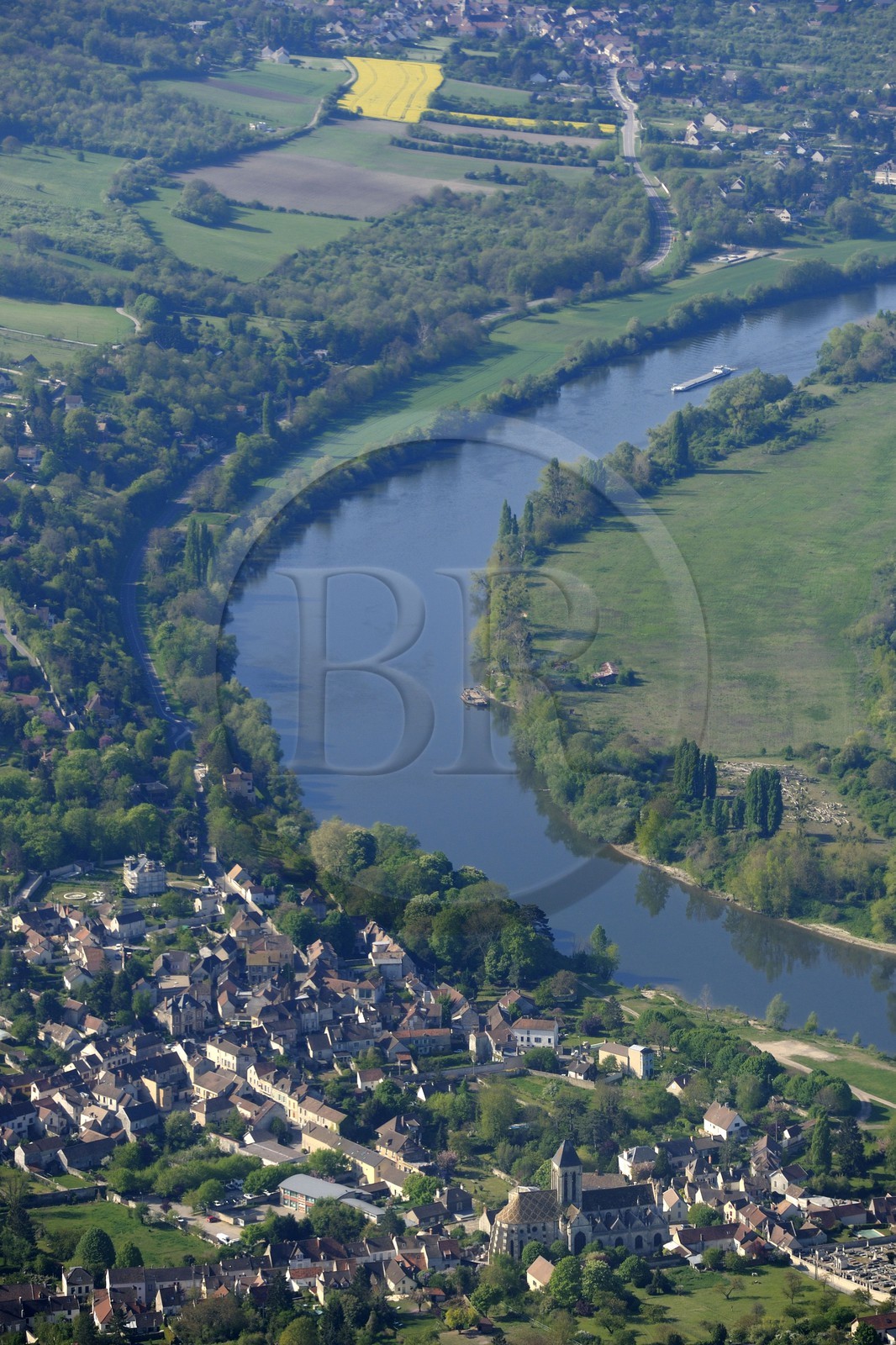 France, Val d'Oise, the village of Vetheuil is nestled in a loop of the Seine river and Notre Dame church painted by Claude Monet (aerial view)
