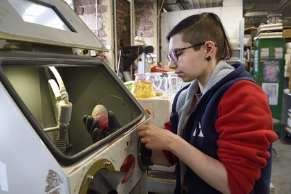 France, Moselle, Meisenthal, Centre international d'Art verrier (CIAV) (international glass centre), Marie has just finished sandblasting on a Christmas ball