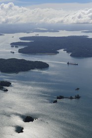 Panama, Panama Canal, Panamax cargo and small islands on Gatun Lake (aerial view)