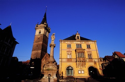 France, Bas Rhin, Obernai, market square, the chapel tower, Sainte Odile fountain and the town hall