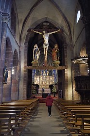 France, Haut Rhin, Strasbourg, Kaysersberg, Sainte-Croix church, triumphant Christ with 15th century statues of the Virgin and Saint John suspended under the vault of the transept and the choir with the wooden altarpiece of 1518 by the sculptor Jean Bongart in the background