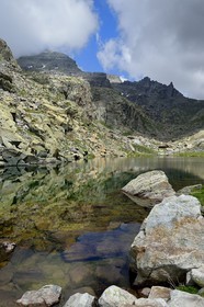 France, Alpes-Maritimes, parc national du Mercantour (Mercantour National Park), the Vallee des Merveilles (Valley of Wonders) scattered with thousands of rupestral engravings of the Bronze Age, the Merveilles Lake below the Baisse (pass) de Valmasque and the Mont Grand Capelet (2915 m) in the background left