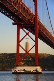 Portugal, Lisbon, 25 de Abril bridge on Tagus river and the Cristo Rei (Christ the King)
