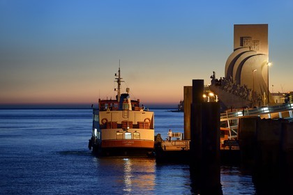 Portugal, Lisbon, Belem District, Padrao dos Descobrimentos (Monument to the Discoveries) dated 1960 at the mouth of the Tagus River, ferry at dock