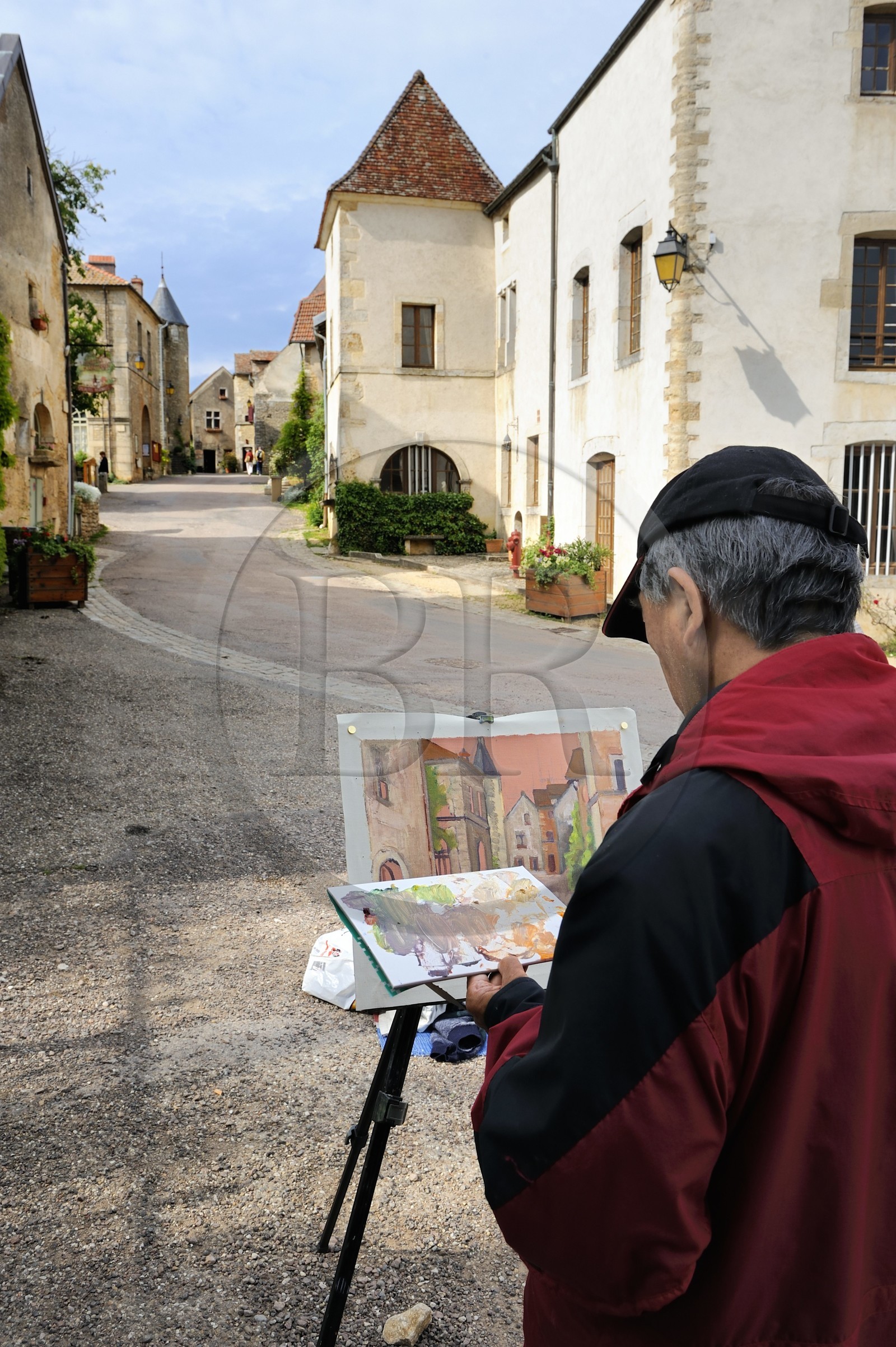 France, Cote d'Or, Chateauneuf en Auxois, labelled Les Plus Beaux Villages de France (The Most Beautiful Villages of France), amateur painter in the main street