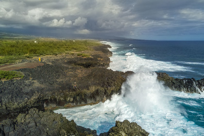 France, Reunion island (French overseas department), L'Etang Salé les Bains, the coast between Le Gouffre and the Etang du Gol (Gol Pond), black basaltic rocks of volcanic origin tormented by the ocean (aerial view)