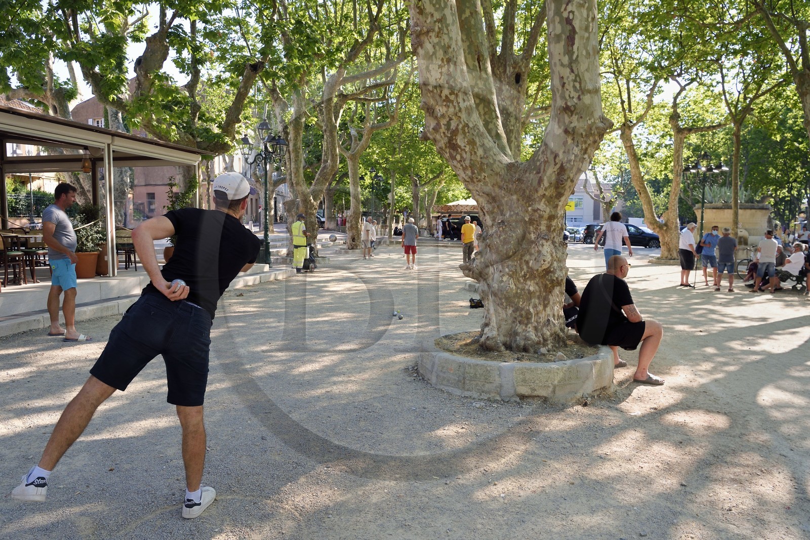 France, Var, Saint-Tropez, petanque players on the Place des Lices at night