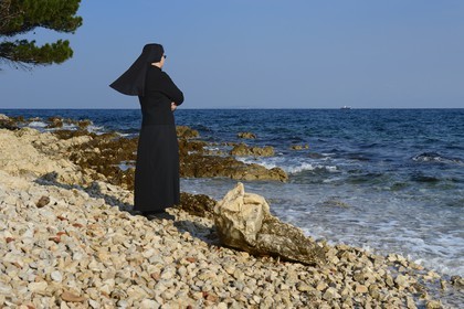 Croatia, Dalmatia, Dalmatian Coast, Ugljan Island, Franciscan St. Jerome Convent of the Congregation of the Sisters of Mercy, sister Theresija like contemplating the sea in her spare time