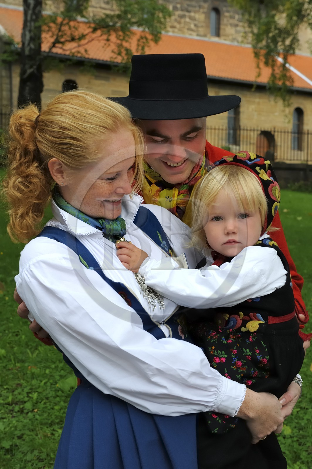 Norway, Oslo, family with Bunad traditional outfit going to the mass at Gamle Aker kirke
