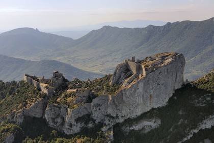 France, Aude, Peyrepertuse, the ruins of Cathar castle built in XIIth century and the castle of Queribus in shape in the background (aerial view)