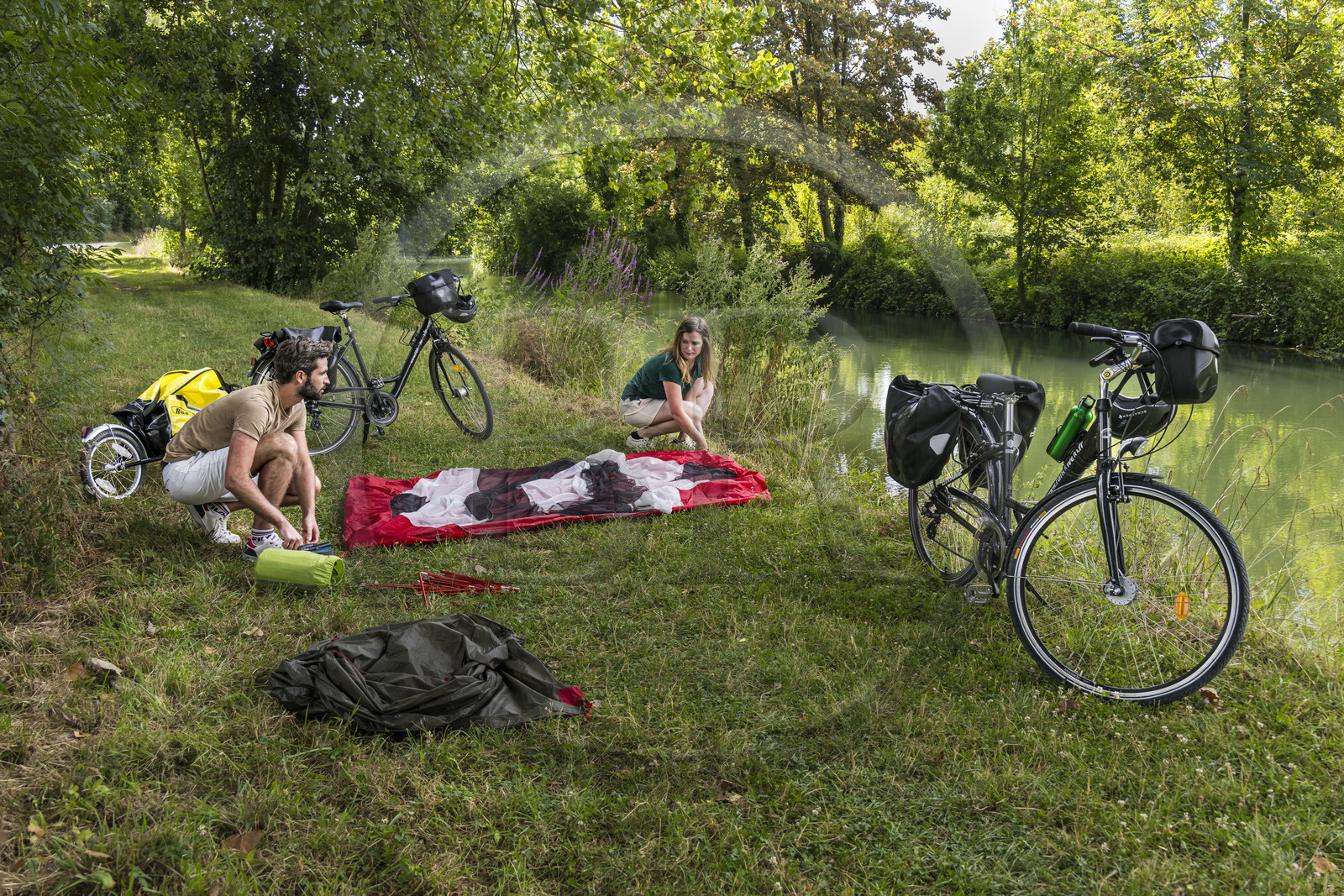 France, Deux-Sèvres, le Marais Poitevin, Green Venice, Magné, bicycle journey, setting up camp for the night along the Sevre Niortaise River banks