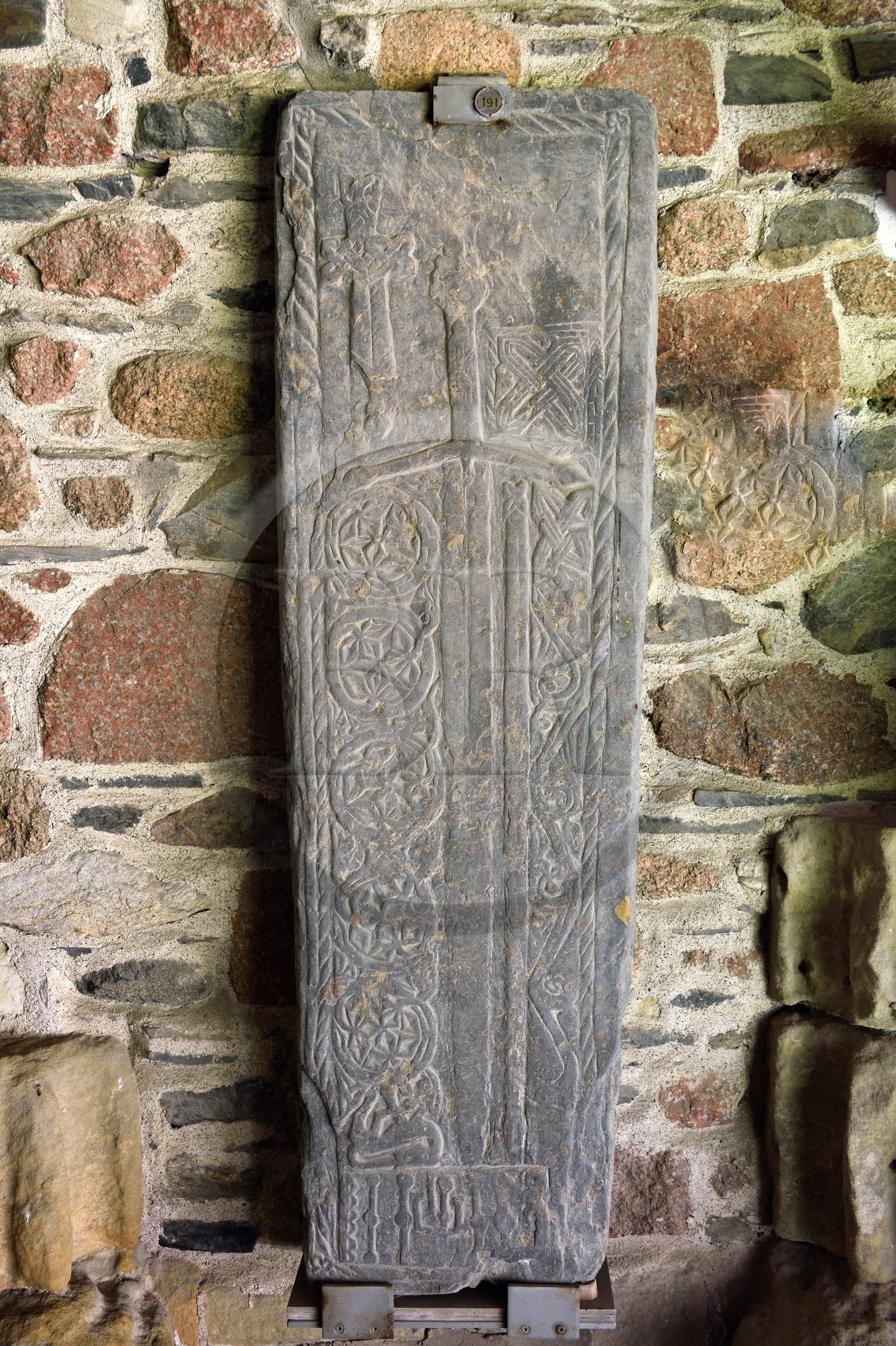 United Kingdom, Scotland, Highland, Inner Hebrides, Isle of Iona facing the Isle of Mull, Iona abbey founded by Saint Columba in the 6th century, sword engraved on a Grave Slab circa 1400s in the cloister