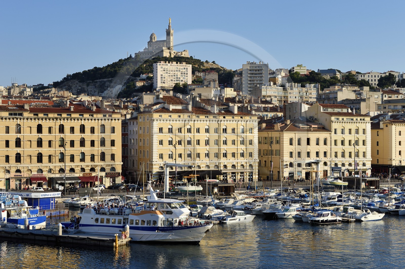 France, Bouches du Rhone, Marseille, the Vieux Port, quai de Rive Neuve, Notre Dame de la Garde in the background