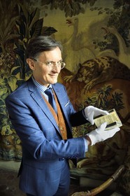 France, Aisne, Château-Thierry, Jean de La Fontaine Museum - city of Chateau-Thierry, the director of the museum pole Nicolas Rousseau holding the La Fontaine's Fables book, Claude Barbin Denys Thierry non illustrated edition, circa 1668, in-12