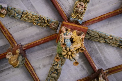 France, Finistere, Pleyben church, wooden painted sculptures on the stringer decorating the vault