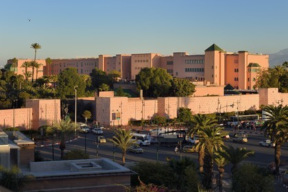 Morocco, High Atlas, Marrakech, Imperial city, Medina listed as World Heritage by UNESCO, the ramparts of the city and the luxury hotel Mamounia in the background