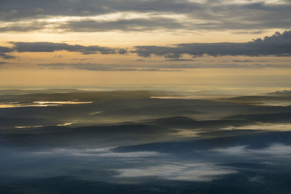 Rwanda, Eastern Province, the land of a thousand hills in the early morning mists (aerial view)