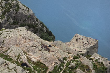 Norway, Rogaland, hikers on the Pulpit Rock (Preikestolen)  in the Lysefjord - fjord of Lysebotn (aerial view)