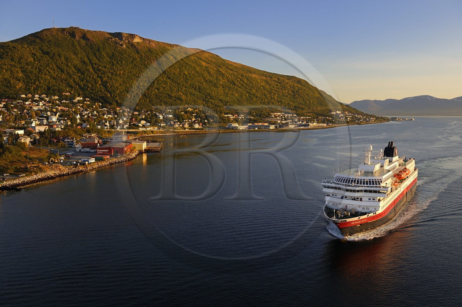 Norway, Troms County, Tromso harbour, the Coastal Express (Hurtigruten) in Tromsesundet Fjord