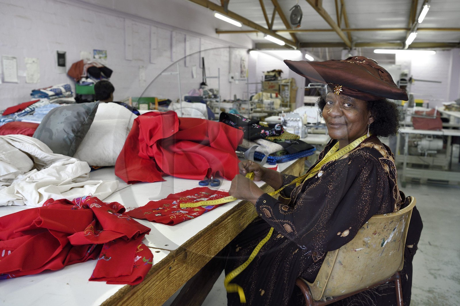 Namibia, Khomas region, Windhoek, Katutura township, Naomie seamstress in the Penduka Village craft center in Herero traditional dress