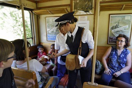 France, Alpes de Haute Provence, between Annot and Saint-Benoit, tickets control by Lucile Isnard aboard a passenger car of the Train des Pignes historic train