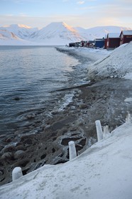 Norway, Svalbard, Spitzbergen, Longyearbyen, wooden houses on the edge of the Adventfjorden