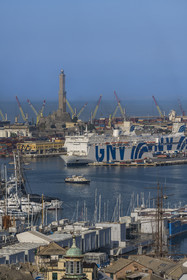 Italy, Liguria, Genoa, the Lanterna lighthouse overlooking the ferry terminal and the commercial port