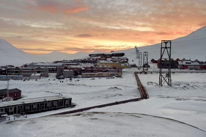 Norway, Svalbard, Spitzbergen, Longyearbyen, thermal heating pipes that cross Longyearbyen above ground because of permafrost and former coal carrying headframes