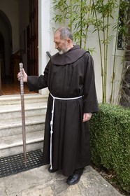 Croatia, Dalmatia, Krka National Park, the Visovac Franciscan Monastery, monk with an alphabet learning rule for the neighborhood kids