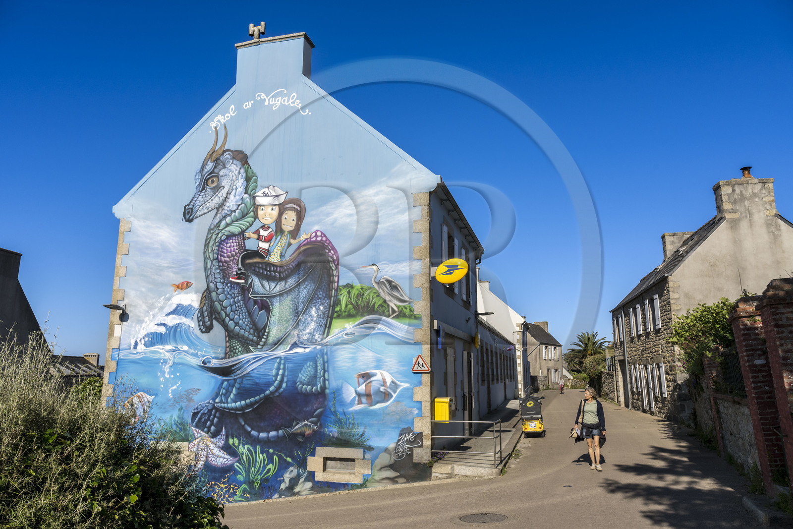 France, Finistère, Ponant Islands, Ile de Batz (Batz Island), mural by street artists Zag and Anje depicting the legend of the dragon on a wall of the Post office