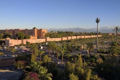 Morocco, High Atlas, Marrakech, Imperial city, Medina listed as World Heritage by UNESCO, Mamounia luxury hotel behind the ramparts of the city and the snow-covered Atlas in the background