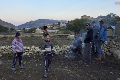Azerbaijan, Quba (Guba) region, Greater Caucasus mountain range, young men and children in the village of Giriz