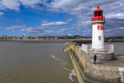 France, Loire-Atlantique, Saint-Nazaire, the west jetty lighthouse on the crab claw (nickname given to the southern entrance to the harbor basin by the two jetties)(aerial view)
