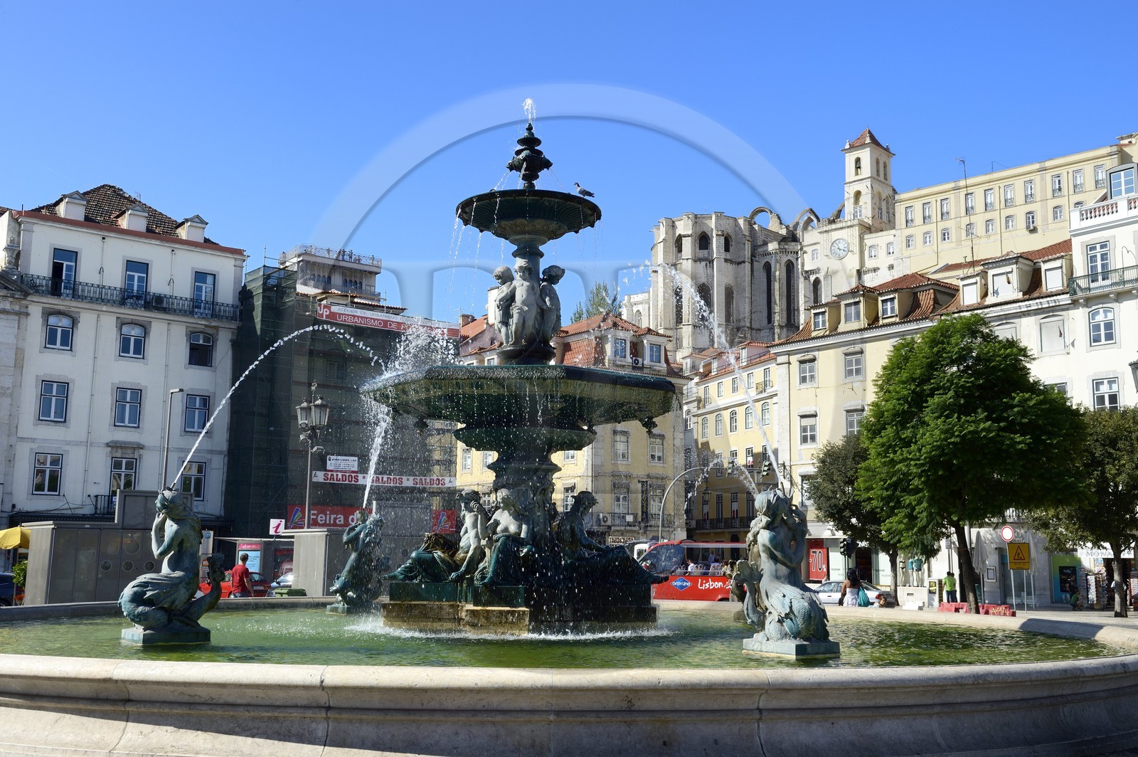 Portugal, Lisbon, Baixa Pombal district, Don Pedro IV (Rossio) square, Baroque Fountain and Do Carmo Church in the background