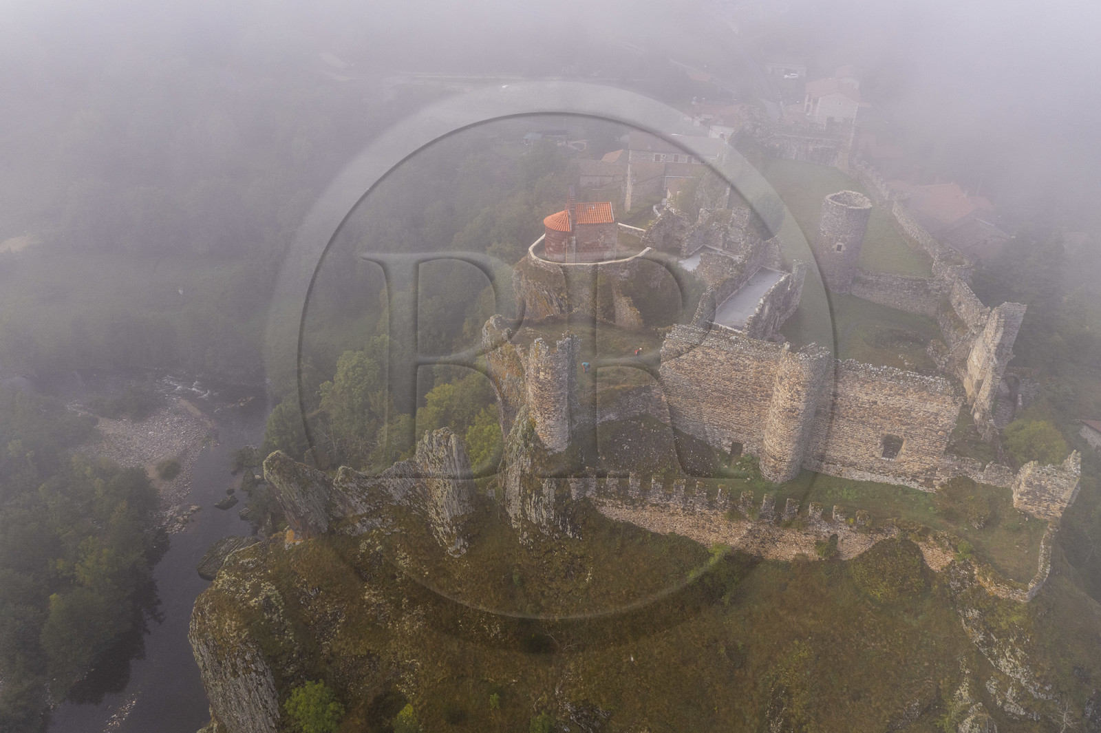 France, Haute Loire, Loire river Valley, Arlempdes, labelized the Most Beautiful Villages of France, ruins of the castle perched on a basalt rock (volcanic dyke) overlooking a Loire river meander (aerial view)