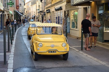 France, Var, Saint-Tropez, Fiat 500 advertising convertible arriving at the port from rue du general Allard