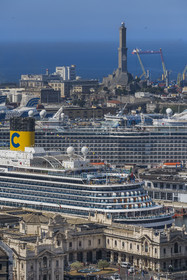 Italy, Liguria, Genoa, the commercial port and the passenger terminal dominated by the Lanterna lighthouse