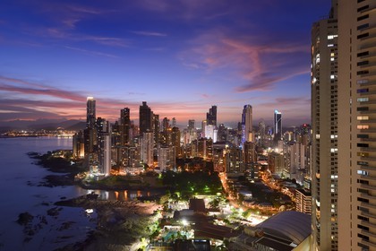 Panama, Panama City, waterfront skyscrapers of Punta Paitillia district after sunset