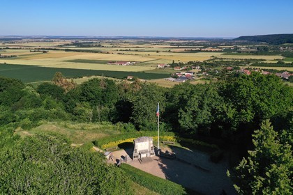 France, Meuse, Lorraine Regional Park, Cotes de Meuse, Les Eparges, fighting place of one of the bloodiest battles of the First World War, monument of point X in memory of those who have no grave and the village of Combres sous les cotes in the background (aerial view)