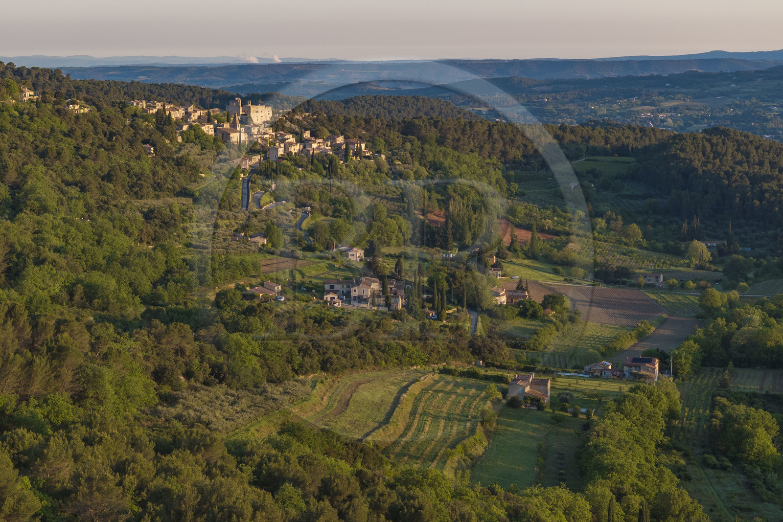 France, Vaucluse, Dentelles de Montmirail mountains, Crestet, the hilltop village of Crestet and its 9th century castle (aerial view)