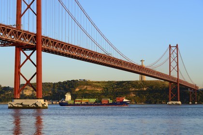 Portugal, Lisbon, 25 de Abril bridge on Tagus river and the Cristo Rei (Christ the King)