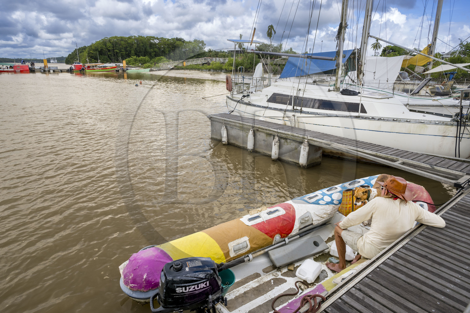 France, French Guiana, Kourou, the Balourous maritime station jetty on the Kourou River, the Canopée docked at the port of Pariacabo in the background