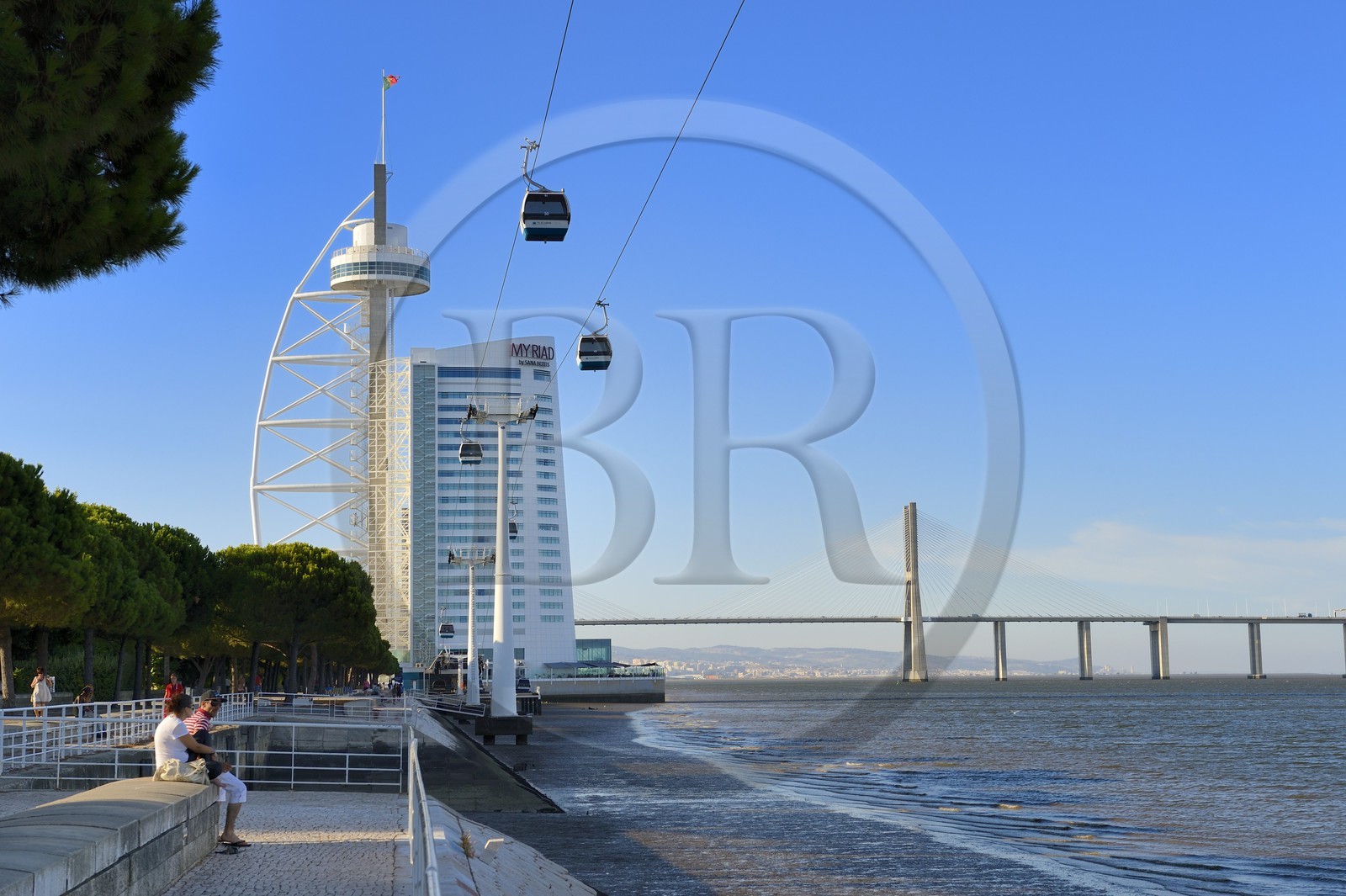 Portugal, Lisbon, Parque das Nações (Nations' Park) built for the Universal Expo 98 World Exhibition, Vasco de Gama Tower hosting the hotel Myriad by SANA Hotels and cable cars running along the Tagus river, in the background the Vasco da Gama Bridge