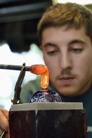 France, Moselle, Meisenthal, Centre international d'Art verrier (CIAV) (international glass centre), the blowing workshop, crafting a Christmas ball, installation of the pellet for the creation of the glass hook