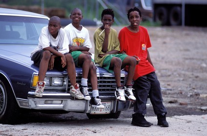 United States, New York City, Manhattan, children sitting on a car