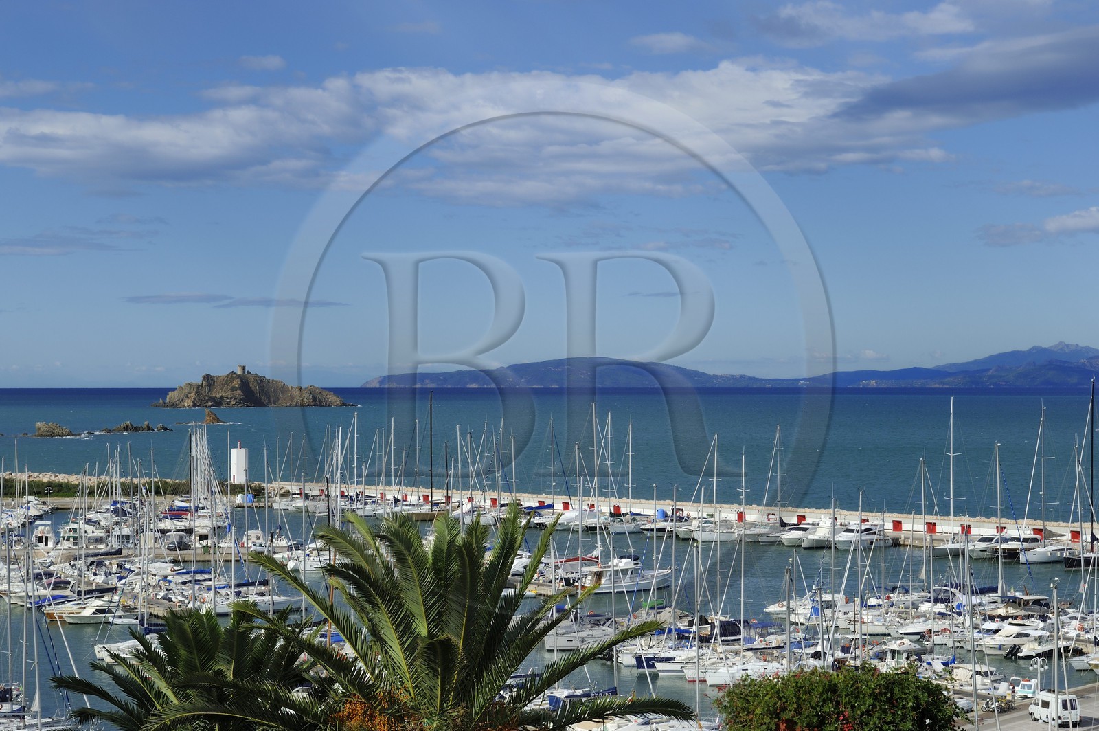 Italy, Tuscany, marina of Punta Ala and the Island of Elba in the background