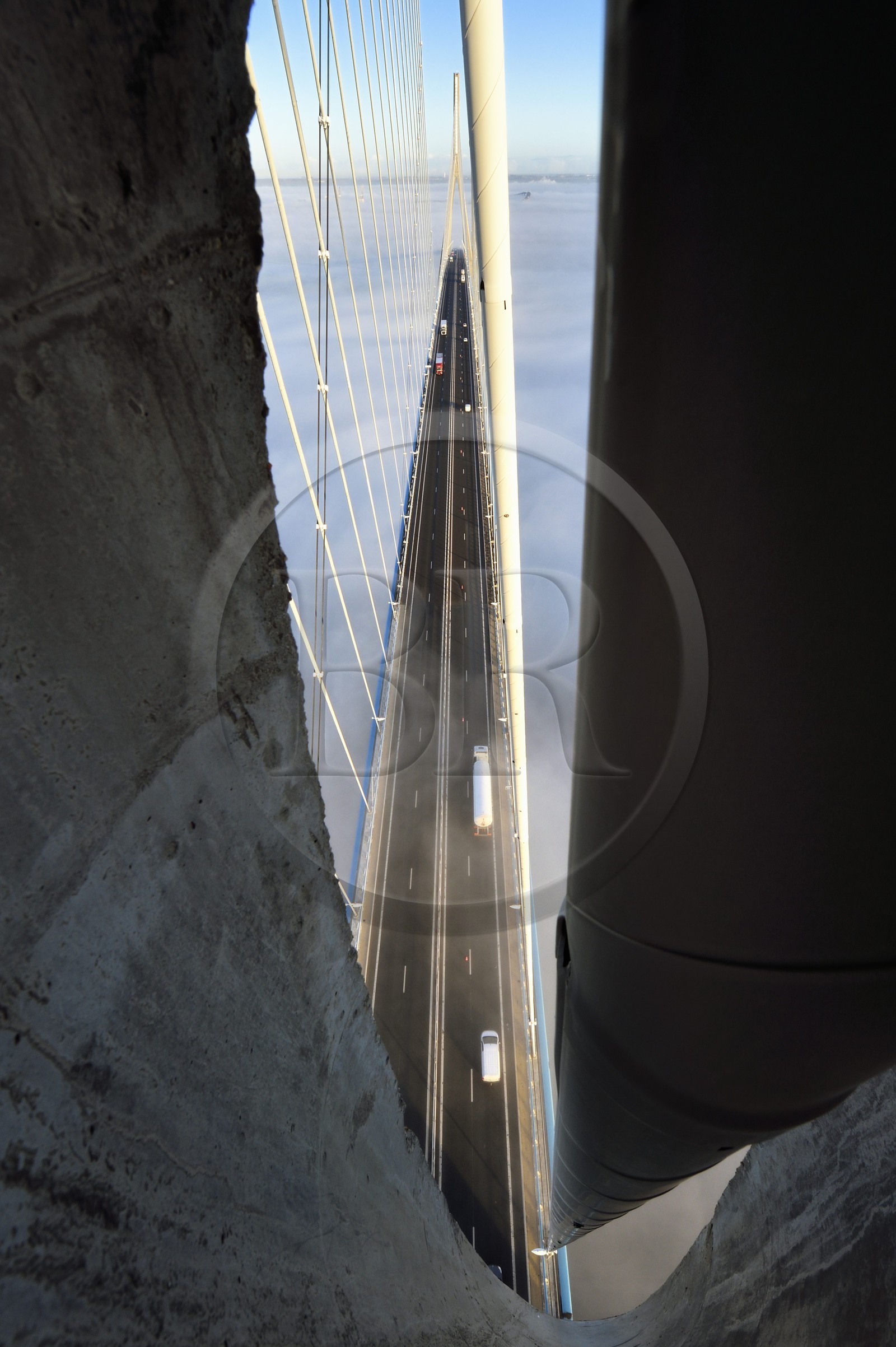 France, between  Calvados and Seine Maritime, the Pont de Normandie (Normandy Bridge) spans the Seine, opening in the pylon to pass a cable that supports the bridge