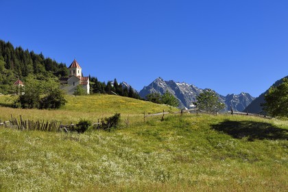 Georgia, Upper Svaneti (Zemo Svaneti), Mestia, orthodox chapel above a meadow on the foothills of Mount Ushba