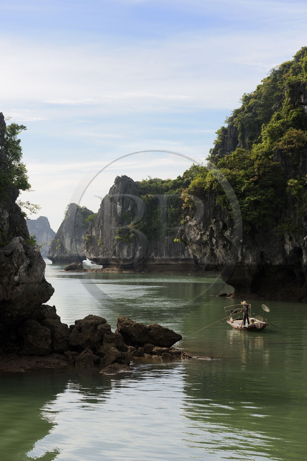 Vietnam, Quang Ninh Province, Halong Bay, listed as World Heritage by UNESCO, fishing boat